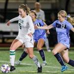 Photo courtesy of Rick Edelman/Rick Edelman Photography                                The Skyline Spartans girls soccer team registered a 2-0 victory against the Rogers Rams in the first round of the Class 4A state playoffs on Nov. 8 at Skyline High School in Sammamish. Skyline senior midfielder McKenna Ross, left, dribbled the ball down the field while being chased by a Rams player.
