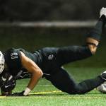 Photo courtesy of Rick Edelman/Rick Edelman Photography                                The Eastside Catholic Crusaders football team defeated Edmonds-Woodway 42-13 in the first round of the Class 3A state playoffs on Nov. 10 at Memorial Stadium in Seattle. Crusaders sophomore wide receiver Gee Scott Jr (pictured) hauls in a touchdown pass despite tight coverage from an Edmonds-Woodway defensive back in the contest. Eastside Catholic (10-0) will face the Garfield Bulldogs in the Class 3A quarterfinals on Nov. 17 or Nov. 18.