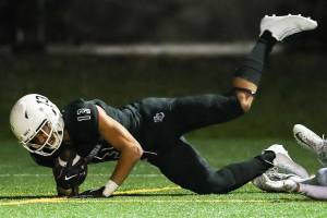Photo courtesy of Rick Edelman/Rick Edelman Photography                                The Eastside Catholic Crusaders football team defeated Edmonds-Woodway 42-13 in the first round of the Class 3A state playoffs on Nov. 10 at Memorial Stadium in Seattle. Crusaders sophomore wide receiver Gee Scott Jr (pictured) hauls in a touchdown pass despite tight coverage from an Edmonds-Woodway defensive back in the contest. Eastside Catholic (10-0) will face the Garfield Bulldogs in the Class 3A quarterfinals on Nov. 17 or Nov. 18.