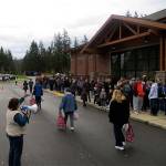 Families line up outside Eastridge Church waiting to receive a free turkey and bag of groceries from church volunteers in years past. File photo
