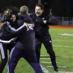 Photo courtesy of Don Borin/Stop Action Photography                                Issaquah head coach Tom Bunnell, center, celebrates with assistant coaches in the seconds after the Eagles defeated the Central Valley Bears in the Class 4A state soccer title game.