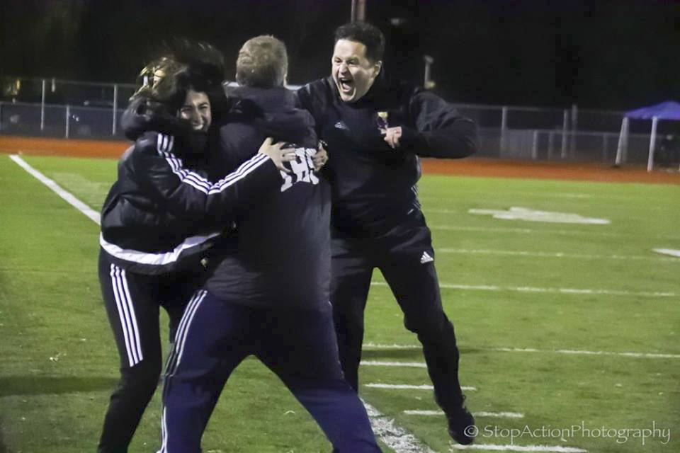 Photo courtesy of Don Borin/Stop Action Photography                                Issaquah head coach Tom Bunnell, center, celebrates with assistant coaches in the seconds after the Eagles defeated the Central Valley Bears in the Class 4A state soccer title game.