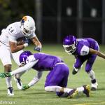 Photo courtesy of Rick Edelman/Rick Edelman Photography                                The Garfield Bulldogs defeated the Eastside Catholic Crusaders 13-10 in double overtime in a Class 3A football quarterfinal matchup on Nov. 17 at Memorial Stadium in Seattle. The Crusaders finished the 2017 season with an overall record of 10-1. Eastside Catholic sophomore tight end DJ Rogers, left, gets tackled by Garfield defensive back TreShaun Harrison, right, during the game on Nov. 17.