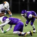 Photo courtesy of Rick Edelman/Rick Edelman Photography                                The Garfield Bulldogs defeated the Eastside Catholic Crusaders 13-10 in double overtime in a Class 3A football quarterfinal matchup on Nov. 17 at Memorial Stadium in Seattle. The Crusaders finished the 2017 season with an overall record of 10-1. Eastside Catholic sophomore tight end DJ Rogers, left, gets tackled by Garfield defensive back TreShaun Harrison, right, during the game on Nov. 17.