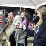 The petting zoo drew big crowds to the holiday celebration with a llama, a camel, pigs, and goats. (Evan Pappas/Staff Photo)
