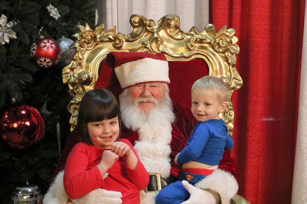 Maia and William Riley tell Santa what they want for Christmas. (Evan Pappas/Staff Photo)