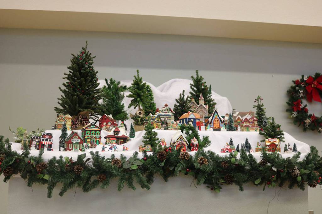Jeannette Hudson and Diane Setterholm decorated the senior center, including this festive Christmas village. Nicole Jennings/staff photo