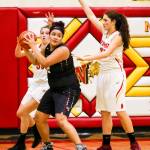 Photo courtesy of Rick Edelman/Rick Edelman Photography                                Eastlake Wolves sophomore Keeli Burton, center, prepares to make a move toward the basket in the low post. Burton scored 16 points in Eastlakes 70-52 victory against the Newport Knights on Dec. 8 at Newport High School in Factoria.
