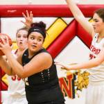 Photo courtesy of Rick Edelman/Rick Edelman Photography                                Eastlake Wolves sophomore Keeli Burton, center, prepares to make a move toward the basket in the low post. Burton scored 16 points in Eastlakes 70-52 victory against the Newport Knights on Dec. 8 at Newport High School in Factoria.