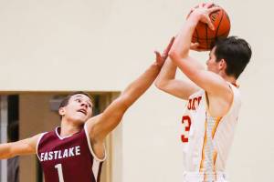Photo courtesy of Rick Edelman/Rick Edelman Photography                                Eastlake Wolves senior Jaxon Williams, left, plays stellar defense against Newport shooting guard Elliot Thompson. Newport defeated Eastlake 43-39 on Dec. 8 at Newport High School in Factoria.