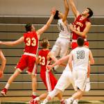 Photo courtesy of Rick Edelman/Rick Edelman Photography                                The Newport Knights boys basketball team defeated the Skyline Spartans 57-55 in a close game between KingCo 4A rivals on Dec. 15 at Skyline High School in Sammamish. The Spartans dropped to 5-3 overall with the loss. Skyline senior guard Sean Wright (pictured) leaped into the air to try to grab a rebound from Newport post player Alexander Tzekov.