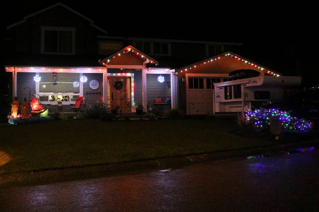 Santa leads his reindeer in a boat across this yard. Nicole Jennings/staff photo