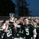 Shaun Scott, staff photo                                The Skyline Spartans boys lacrosse team celebrated with the championship trophy after defeating the Eastlake Wolves 9-7 in the Washington High School boys lacrosse 4A state championship game on May 27 at Starfire Sports Complex in Tukwila.