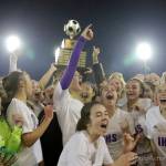 Photo courtesy of Don Borin/Stop Action Photography                                The Issaquah Eagles girls soccer team hoists the championship trophy following their 2-1 victory against the Central Valley Bears in the Class 4A girls soccer state title game on Nov. 18 at Sparks Stadium in Puyallup.