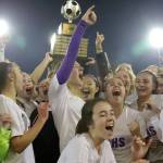 Photo courtesy of Don Borin/Stop Action Photography                                The Issaquah Eagles girls soccer team hoists the championship trophy following their 2-1 victory against the Central Valley Bears in the Class 4A girls soccer state title game on Nov. 18 at Sparks Stadium in Puyallup.