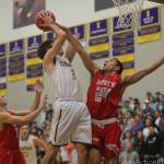 Photo courtesy of Don Borin/Stop Action Photography                                The Issaquah Eagles boys basketball team earned a 68-64 victory against the Mount Si Wildcats on Jan. 5. Issaquah improved its overall record to 4-6 with the win. Issaquah senior forward Will Farmer, left, takes the ball strong to the hoop against Mount Si junior guard Bijon Sidhu.