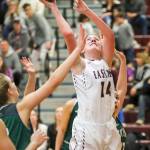 Photo courtesy of Rick Edelman/Rick Edelman Photography                                Eastlake Wolves senior forward Stacie Keck records a bucket in the paint against the Skyline Spartans in a matchup between KingCo 4A rivals on Jan. 12 in Sammamish. The Wolves defeated the Spartans 74-61.
