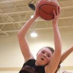 Photo courtesy of Don Borin/Stop Action Photography                                Issaquah sophomore forward Katie MacNary pulls down a rebound against the Newport Knights on Jan. 26. Newport defeated Issaquah 63-57 in the KingCo 4A matchup.