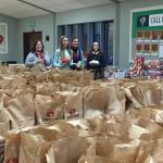 Volunteers collect meals for families in need. Photo courtesy of Issaquah Food and Clothing Bank