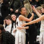 Photo courtesy of Don Borin/Stop Action Photography                                Eastlake Wolves senior point guard Gina Marxen embraces coaches and teammates after on senior night in the regular season finale against the Issaquah Eagles on Feb. 6.