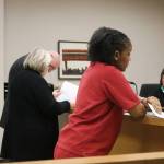 KaDeidre Rials, center, was sentenced to four-and-a-half years in jail on Friday afternoon at the King County Courthouse. Nicole Jennings/staff photo