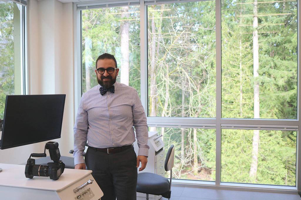Khosravis office looks out onto a woodsy landscape. Nicole Jennings/staff photo