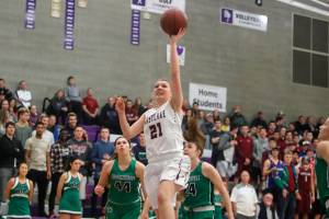 Photo courtesy of Don Borin/Stop Action Photography                                Eastlake Wolves senior Cameron Edward, who will play college basketball at Pomona College next season, drives to the hoop against the Woodinville Falcons in the Class 4A KingCo tournament championship game on Feb. 15. Woodinville defeated Eastlake 75-61.