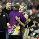 Photo courtesy of Don Borin/Stop Action Photography                                Issaquah Eagles 113-pound wrestler Carson Tanner, right, embraces Issaquah assistant coach Manny Brown after defeating Hanfords Hunter Murphey in the Class 4A 113-pound quarterfinal matchup. Tanner earned sixth place in the Class 4A 113-pound weight division. Brown was named KingCo 4A assistant coach of the year during the 2017-18 season.