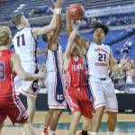 Photo courtesy of Patrick Krohn/Washington Prep Athletics Network                                Eastside Catholic Crusaders freshman Jaylahn Tuimoloau, right, pulls down a rebound in the first round of the Class 3A state playoffs on Feb. 28 at the Tacoma Dome.
