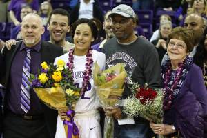 Photo courtesy of Don Borin/Stop Action Photography                                University of Washington Huskies womens senior basketball player Mackenzie Wieburg, center, shares a moment with family members and friends following the final home game of her collegiate career on Feb. 25 at Alaska Airlines Arena in Seattle. The University of California Golden Bears defeated the Huskies 83-67 in the Pacific Conference 12 matchup. Wieburg, who is a 2014 graduate of Issaquah High School, went 3-for-6 from the field and scored seven points in the contest.