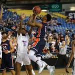 Photo courtesy of Don Borin/Stop Action Photography                                Eastside Catholic Crusaders guard Shane Nowell drives to the hoop against the Garfield Bulldogs in the Class 3A state semifinals on March 2 at the Tacoma Dome. Garfield earned a 56-48 victory against Eastside Catholic.