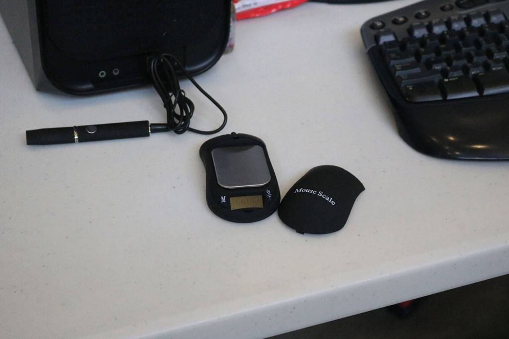 A scale for weighing drugs is hidden inside a computer mouse. Nicole Jennings/staff photo