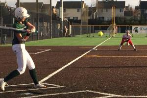 Shaun Scott, staff photo                                Skyline Spartans shortstop Taylor Juenke prepares to take a swing in the season opener against the Juanita Rebels on March 12 at Skyline High School in Sammamish. Juenke connected on a two-run homer in the bottom of the fifth inning. The Spartans defeated the Rebels 12-7.