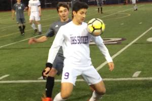 Shaun Scott, staff photo                                Issaquah Eagles forward Jacob Barsher controls the ball while being guarded by Mount Sis Inaki McCarthy in the first half of play. Issaquah defeated Mount Si 2-0 in overtime on March 24 at Gary Moore Stadium in Issaquah.
