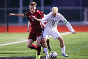 Photo courtesy of Rick Edelman/Rick Edelman Photography                                The Skyline Spartans and Eastlake Wolves battled to a 1-1 tie in a KingCo 4A boys soccer matchup on March 30 in Sammamish. Skyline currently has an overall record of 4-0-2. Eastlake currently has an overall record of 4-1-2. Eastlake midfielder Harri Eames, left, and Skyline senior Joseph Camp, right, battle for possession of the ball in the above picture.