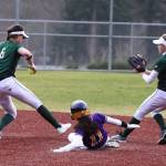 Photo courtesy of Don Borin/Stop Action Photography                                Skyline Spartans shortstop Taylor Juenke, left, hustles to tag second base while Issaquah sophomore Kendal Gentzen slides into second base in a contest between KingCo 4A rivals on March 30 at Issaquah High School.