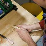TogetherMade owner Jeb Haber assembles a wooden pocket knife kit which he manufactures out of his shop near Fall City. Aaron Kunkler/Staff photo