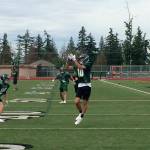 Skyline Spartans sophomore wide receiver Karl Herrmann hauls in a pass during a spring football practice session on June 12 at Skyline High School in Sammamish. Shaun Scott, staff photo