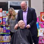 Erin Hansmans head is officially shaved and she is all smiles. Photo courtesy of Eastside Baby Corner