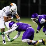 Eastside Catholic Crusaders tight end DJ Rogers, left, gets tackled against the Garfield Bulldogs in the Class 3A state quarterfinals on Nov. 17, 2017. The Crusaders finished the 2017 season with an overall record of 10-1. Photo courtesy of Rick Edelman/Rick Edelman Photography