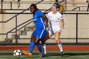 The Issaquah Gunners FC womens soccer team, which competes in the WPSL, earned a 2-1 win against the Eugene Timbers FC Azul on June 16 at Issaquah High School. The Gunners improved their overall record to 2-0-1 with the victory. Natasha Baptiste, left, controls the ball against the Timbers. Photo courtesy of Rick Edelman/Rick Edelman Photography