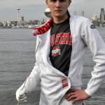 Bothells Matthew Comes poses in his fencing uniform with downtown Seattle as the backdrop. Photo courtesy of John Comes