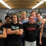Sound Publishing sportswriter Shaun Scott poses for a quick picture with members of the Bellevue Christian Vikings football team following a weight training session on July 19 at Bellevue Christian School in Bellevue. Photo courtesy of Todd Green