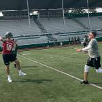 Skyline senior quarterback Joe Green, who will play college football at Harvard next season, takes a deep drop before throwing a screen pass during practice on Aug. 16 in Sammamish. Shaun Scott/staff photo