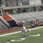 Eastside Catholic Crusaders wide receiver Gee Scott Jr. hauls in a deep pass from assistant coach Greg Prator on the second day of practice. Shaun Scott/staff photo