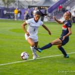 Issaquah Eagles 2017 graduate Kaylene Pang, left, controls the ball during a game against Cal State Fullerton on Aug. 24 in Seattle. The Huskies defeated Cal State Fullerton, 3-0. Pang, who is a sophomore defender with the University of Washington Huskies womens soccer program, made 10 appearances during her freshman season in 2017. Photo courtesy of Don Borin/Stop Action Photography