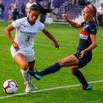 Issaquah Eagles 2017 graduate Kaylene Pang, left, controls the ball during a game against Cal State Fullerton on Aug. 24 in Seattle. The Huskies defeated Cal State Fullerton, 3-0. Pang, who is a sophomore defender with the University of Washington Huskies womens soccer program, made 10 appearances during her freshman season in 2017. Photo courtesy of Don Borin/Stop Action Photography