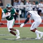 The Skyline Spartans defeated the Kentwood Conquerors, 21-14, in a nonleague matchup on Aug. 31 at Skyline High School in Sammamish. Skyline senior receiver Donovan Bahall, left, prepares to stiff-arm Kentwood defender Dyllon Daniels in the open field. The Spartans will face the Peninsula Seahawks at 7 p.m. on Sept. 7 in Purdy. Photo courtesy of Jim Nicholson