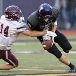 Issaquah Eagles senior wide receiver Lucas Senatore, right, holds on to the ball while Mercer Island defensive back Hunter Johnson, left, tries to dislodge the ball. Photo courtesy of Patrick Krohn/Patrick Krohn Photography