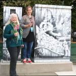 Robin Kelley, chair of the Sister Cities Commission, stands with artist Bergljot Hals at the art installation at the intersection of Second Avenue Southeast and Sunset Way. Courtesy Photo